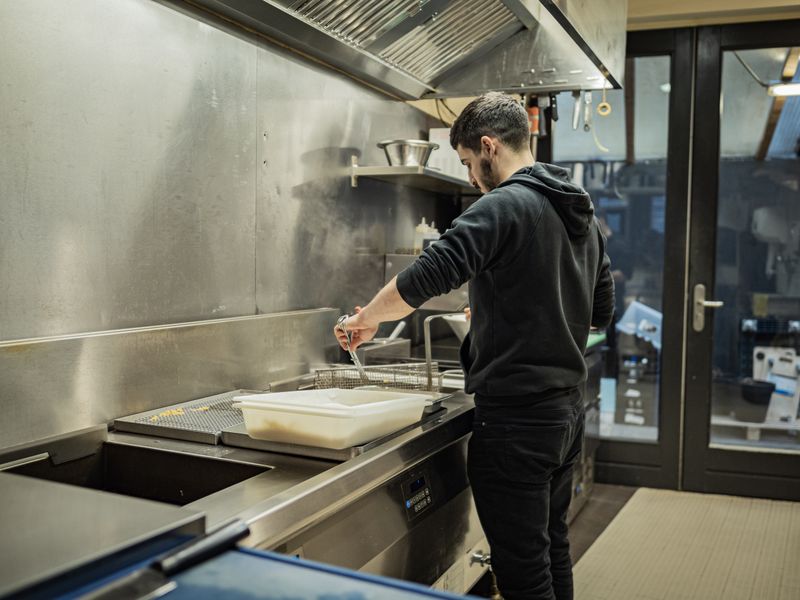 Starbird chicken team working together in a vibrant kitchen