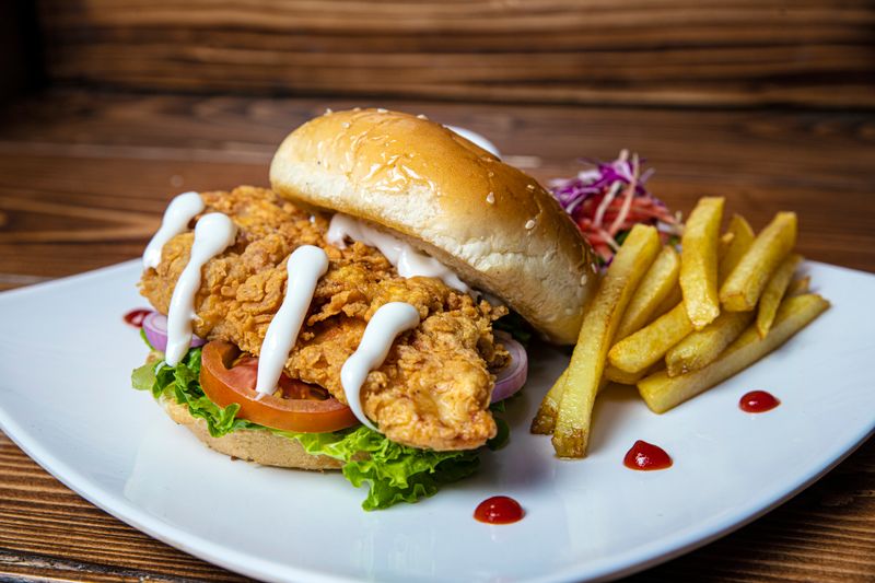 Starbird chicken signature burger close-up — juicy and flavorful